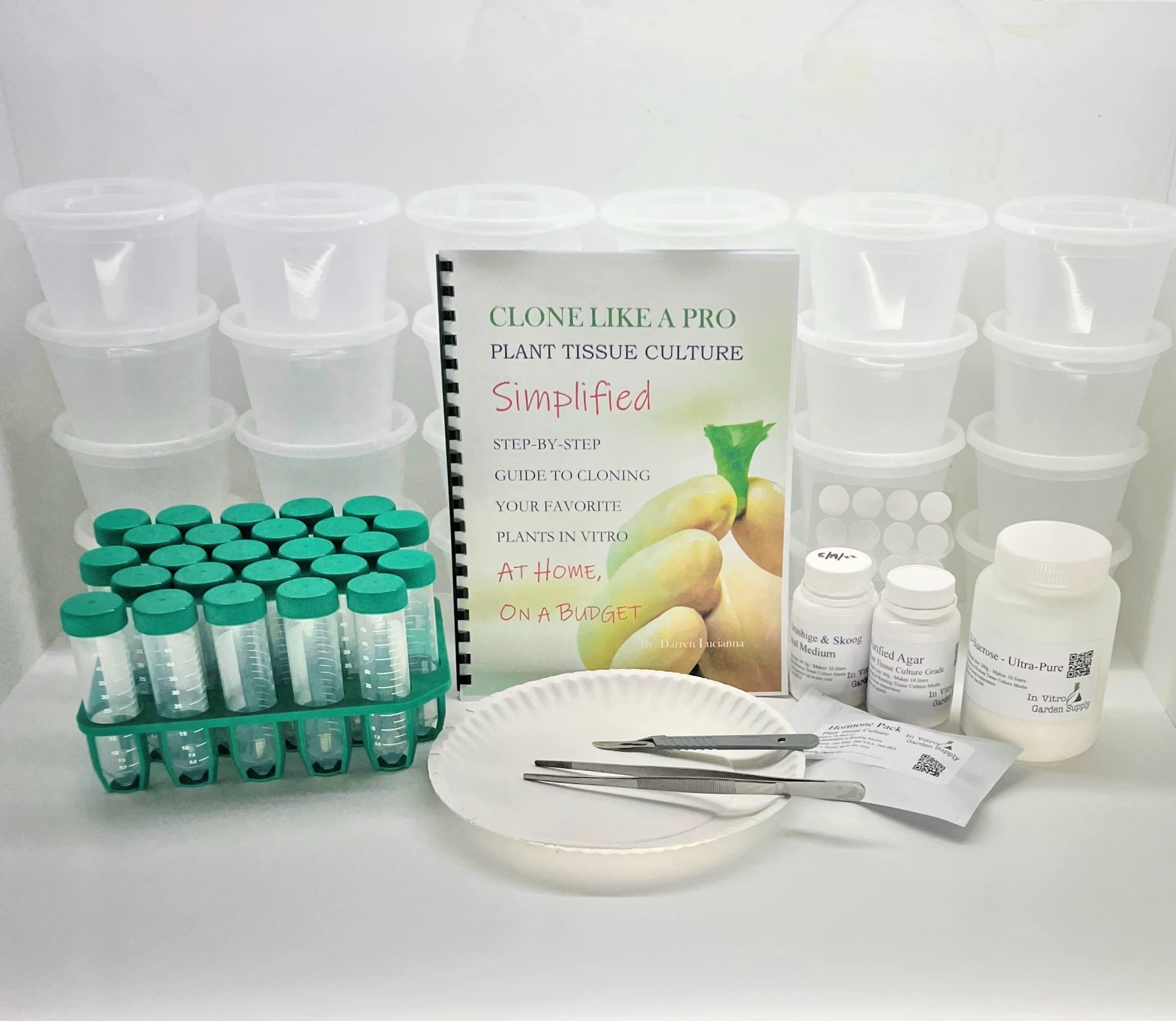 Plant tissue culture grow kit flat lay showing culture containers, forceps, media and agar